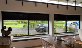 Motorised Light Filtering and Blackout roller blinds in a lifestyle property of Paremoremo  